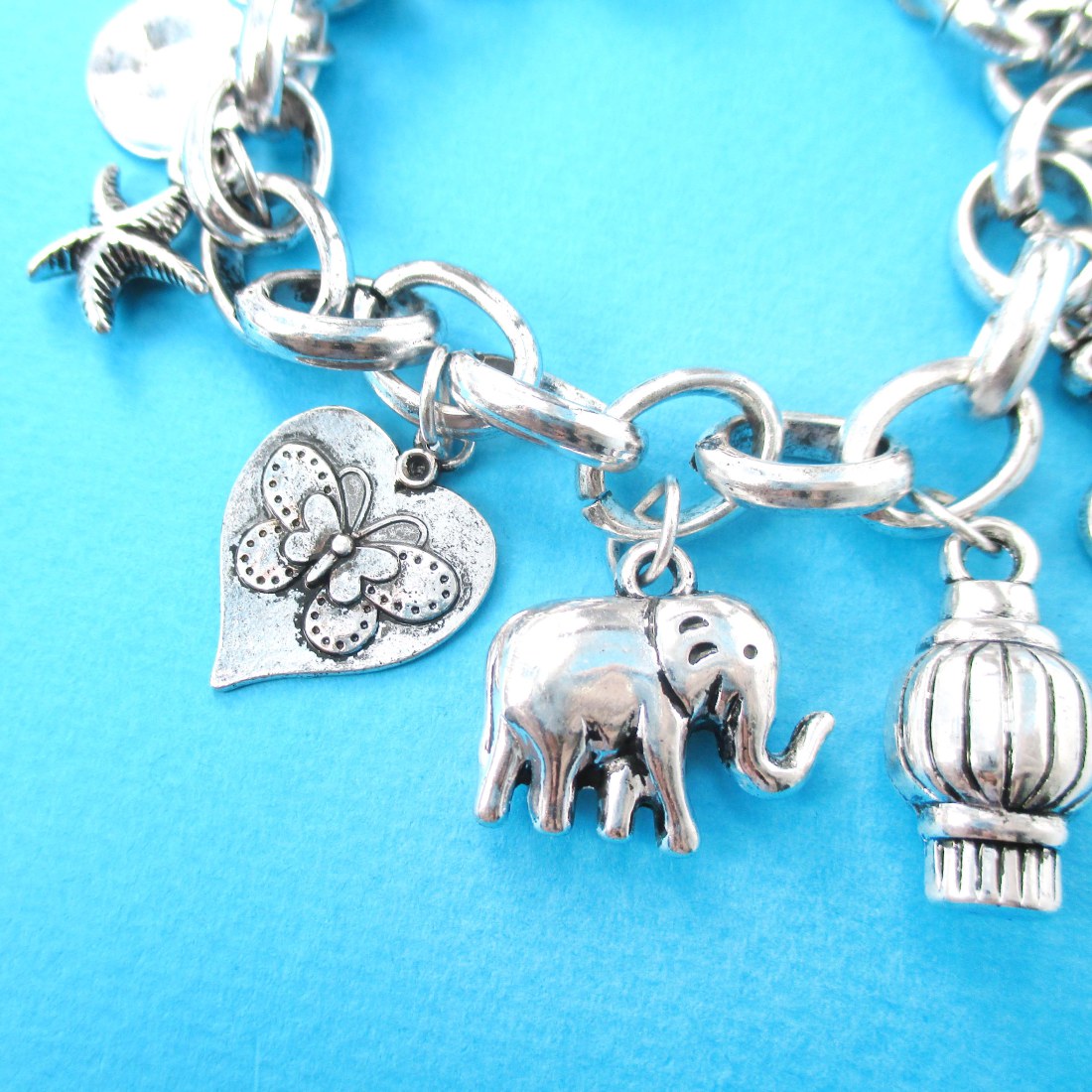 Elephant Starfish Doves Animal Shaped Charm Bracelet in Silver · DOTOLY Animal Jewelry · The