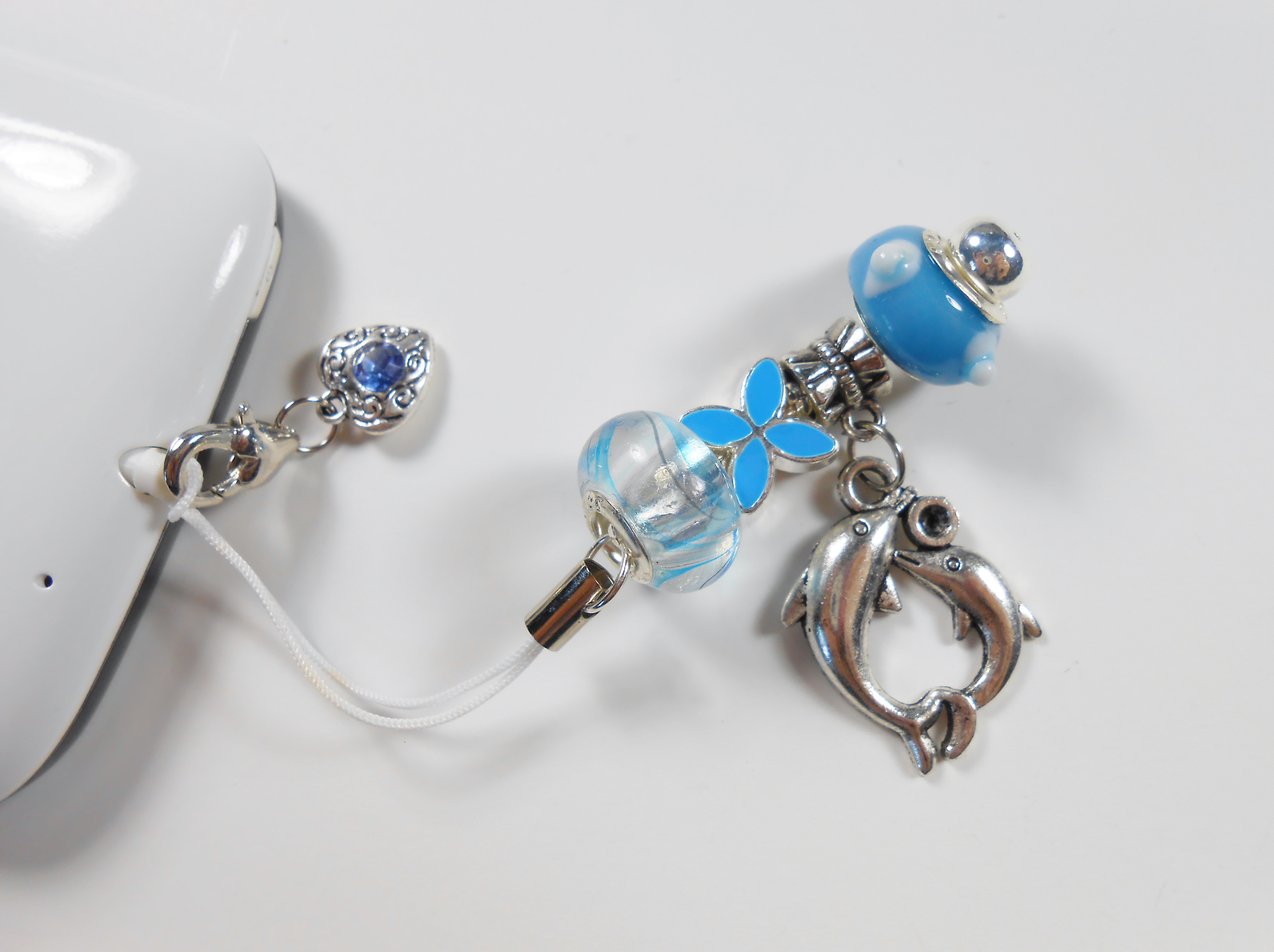 cellphone charm with earphone jack dust cover with light blue lampwork