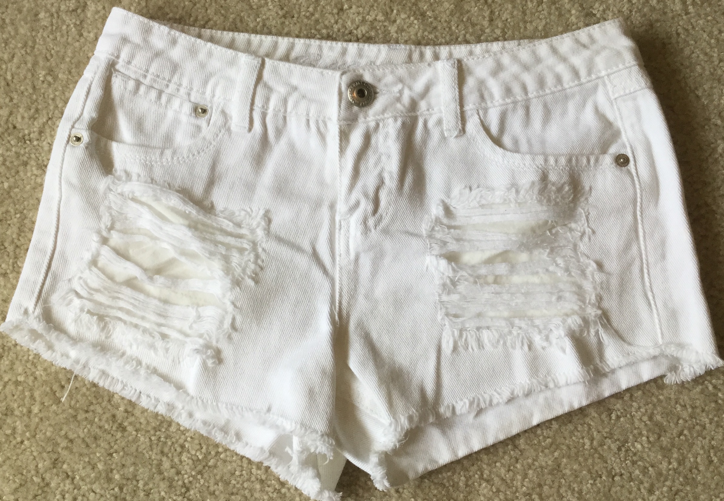white destroyed shorts